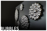 3D wall mirror decor featuring a bubbles-inspired glass composition with reflective surfaces.