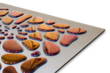 Close-up of 55 Drops Mural, showcasing glossy metallic droplets and fluid mirror wall decor design.