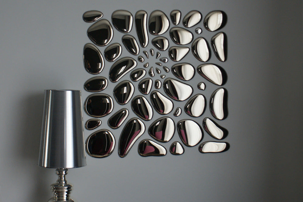 Modern glass mirror wall art in an abstract arrangement, enhancing interior aesthetics with a reflective surface.