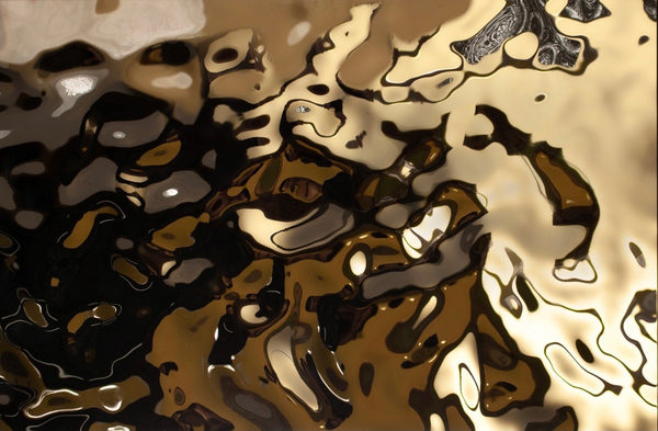 Aqua gold glass wall panel texture close-up