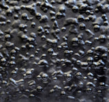 Texture photo of glass wall panel in custom dark finish - CuprumO