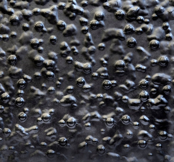 Texture photo of glass wall panel in custom dark finish - CuprumO