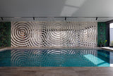Luxury Interior Wall Design: Alternative Interference mirrored wall panel near a private indoor pool