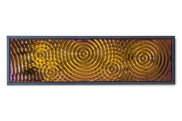 Bronze-colored textured glass panel with a striking interference design, framed for a sophisticated wall decor statement.