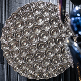 Bubble Reverse circular mirror wall sculpture featuring convex reflective elements that enhance depth and elegance.