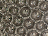 Close-up of Bubble Reverse mirror wall sculpture with metallic bubble textures, creating a futuristic aesthetic
