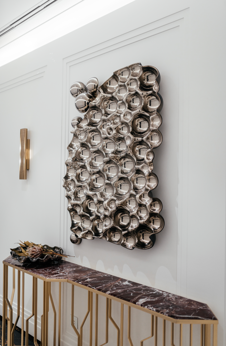 Luxury Glass Sculpture: Luxury bubbles rectangle glass wall sculpture in a high-end hallway with modern decor.