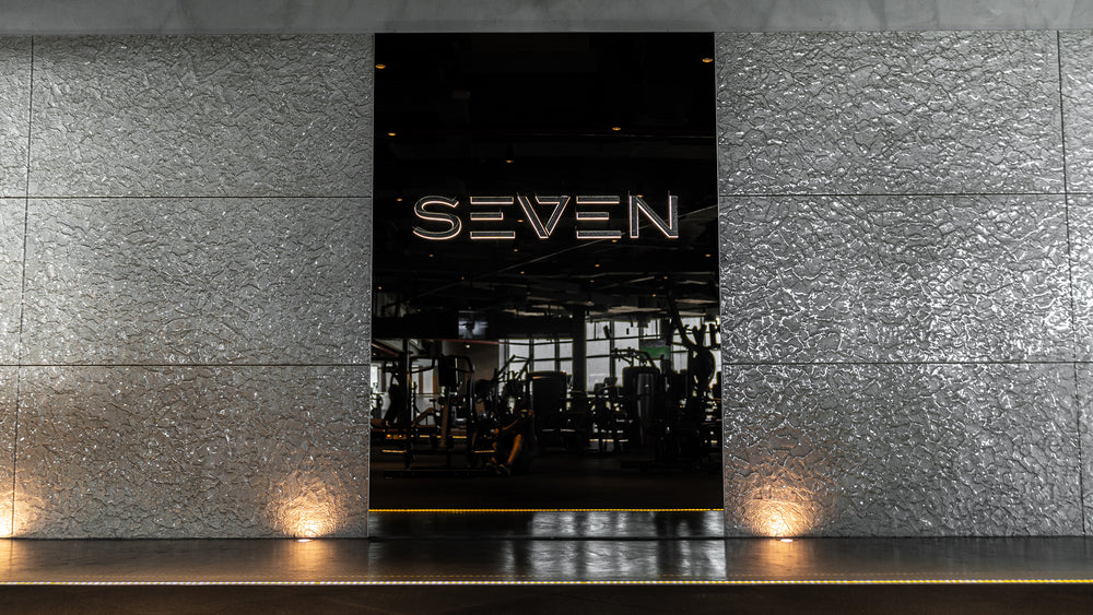 Close-up of champagne glass wall panels showcasing intricate textures and reflective surfaces