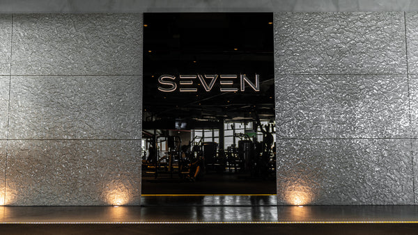 Luxurious champagne glass wall panels installed in a modern gym interior, reflecting ambient lighting and creating a sophisticated atmosphere