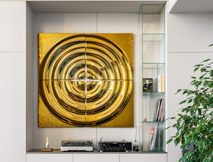 Gold-finished modular glass wall panel "Interference x4" with a circular ripple design, mounted above a vinyl player in a modern interior