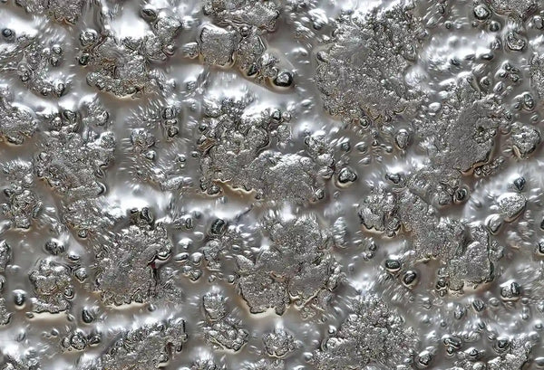 Close-up of Fiama glass wall panel in silver with a highly textured, molten-like luxury surface