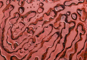 Elegant fingerprint glass panel in a deep red hue, perfect for luxury decor.