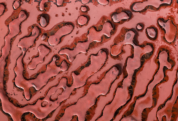 Elegant fingerprint glass panel in a deep red hue, perfect for luxury decor.