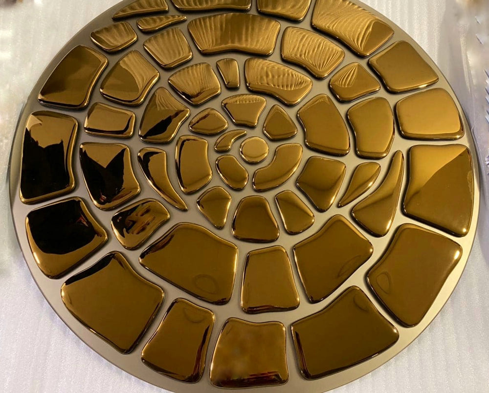 Gold spiral mirror wall decor with a high-gloss reflective finish and organic design.