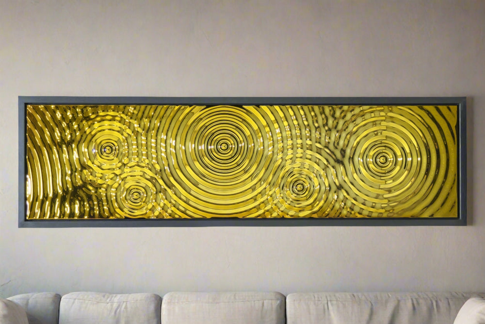 Gold wave-patterned glass mural from the Interference 5 Drops series, adding a luxurious touch to a modern living room decor.
