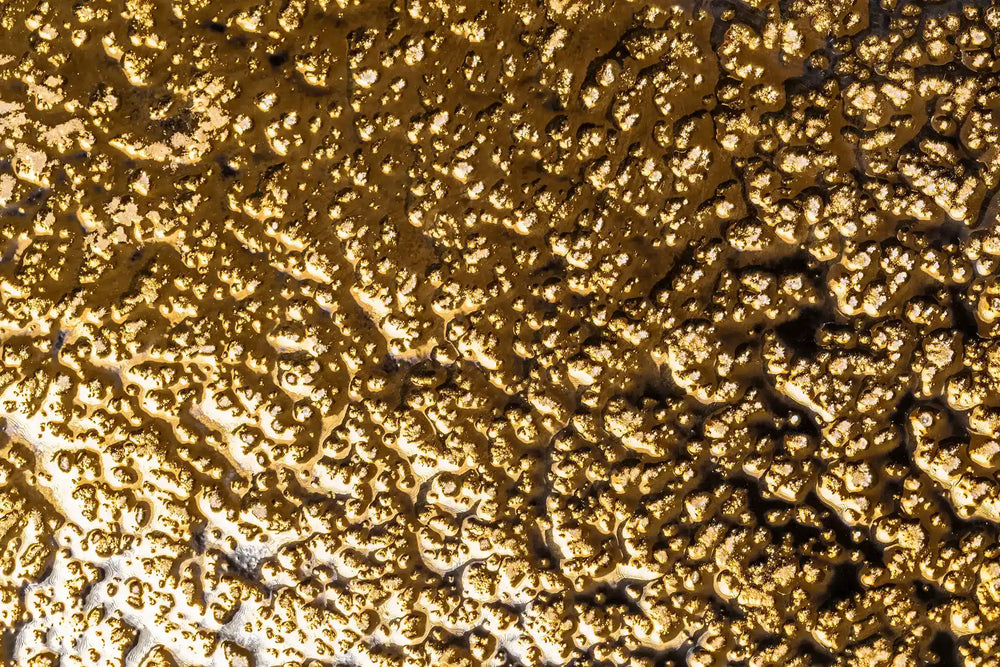 Close-up texture photo of designer Golden Galaxy luxury wall panel