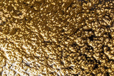 Close-up texture photo of designer Golden Galaxy luxury wall panel