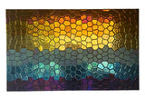 Hexagonal glass mosaic wall panel with a gradient of hues for a modern artistic statement