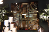 Modern interference glass wall art featuring concentric ripples in a luxury setting.