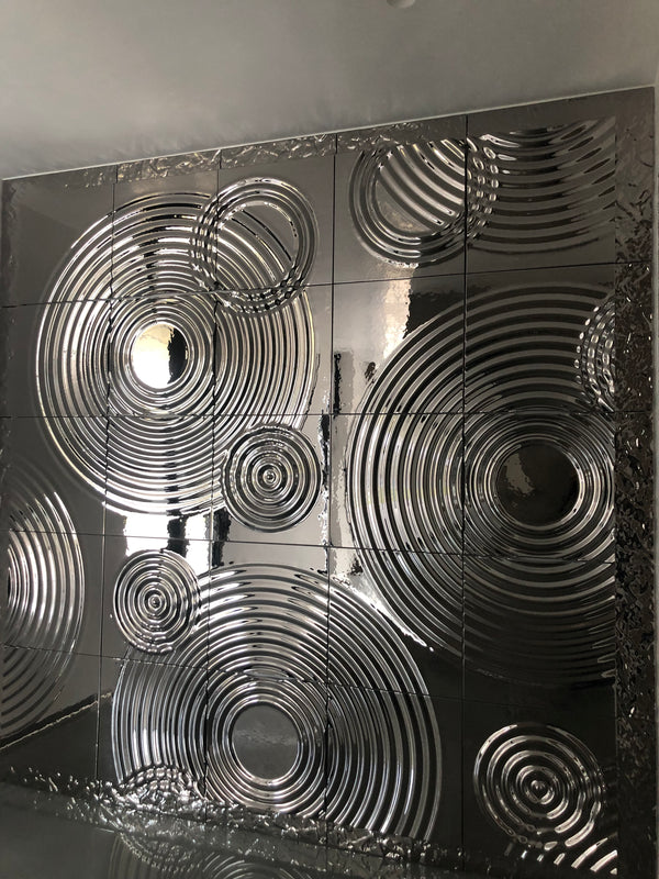 Luxury interior featuring Interference glass panels with polished metallic reflections