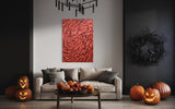 Large luxury fingerprint-inspired red glass wall decor piece displayed on an easel.