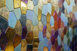 High-end glass wall panel design featuring a unique polygonal pattern with metallic reflections and dynamic color shifts.