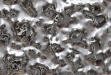 Close-up of the luxury Vento Silver wall panel featuring a textured mirrored glass surface with dynamic reflections.