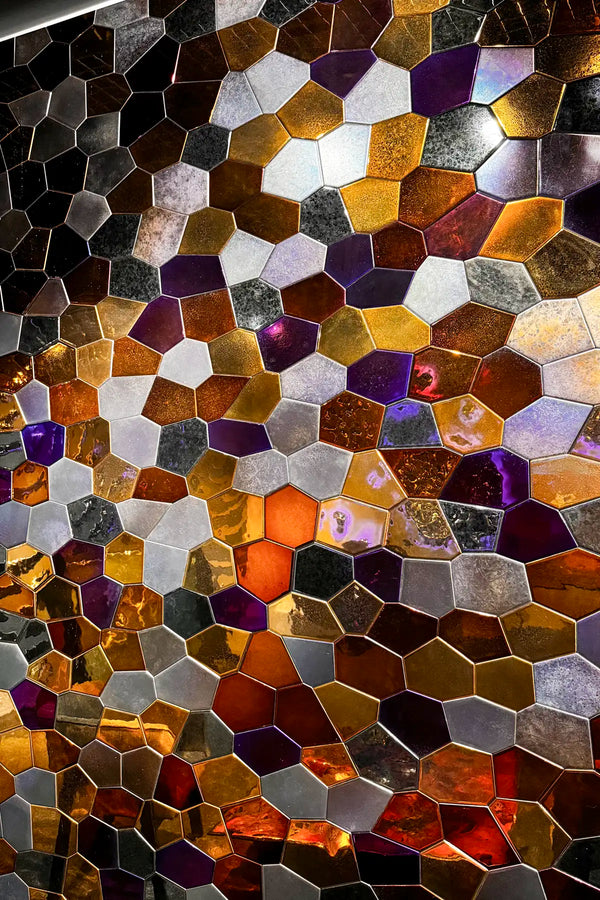 Hexagonal mosaic tile pattern with metallic colors