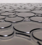 Backside closeup of ornamental semi transparent glass wall panel 'Eclipse'