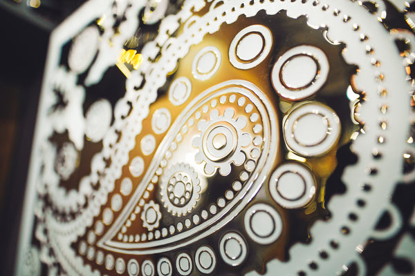 Detailed view of the Paisley Pattern mirrored glass wall panel’s texture, highlighting precise engravings and reflective glass craftsmanship.