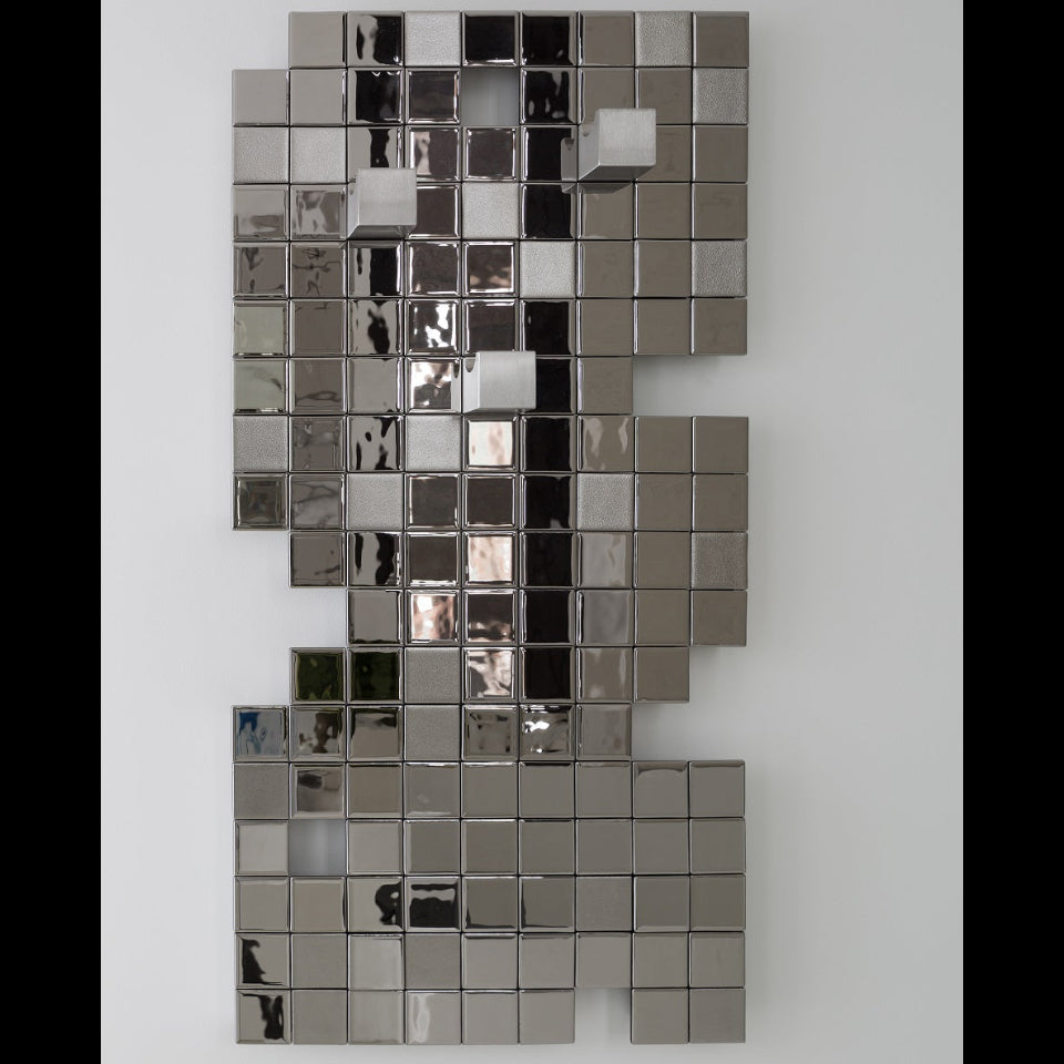 Modern heated towel rack with a stylish Tetris pattern, combining functionality and art.