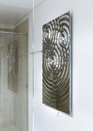A unique wall-mounted towel holder with a sculptural, fluid-metallic surface.